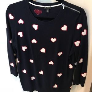 Navy sweater with red and white hearts